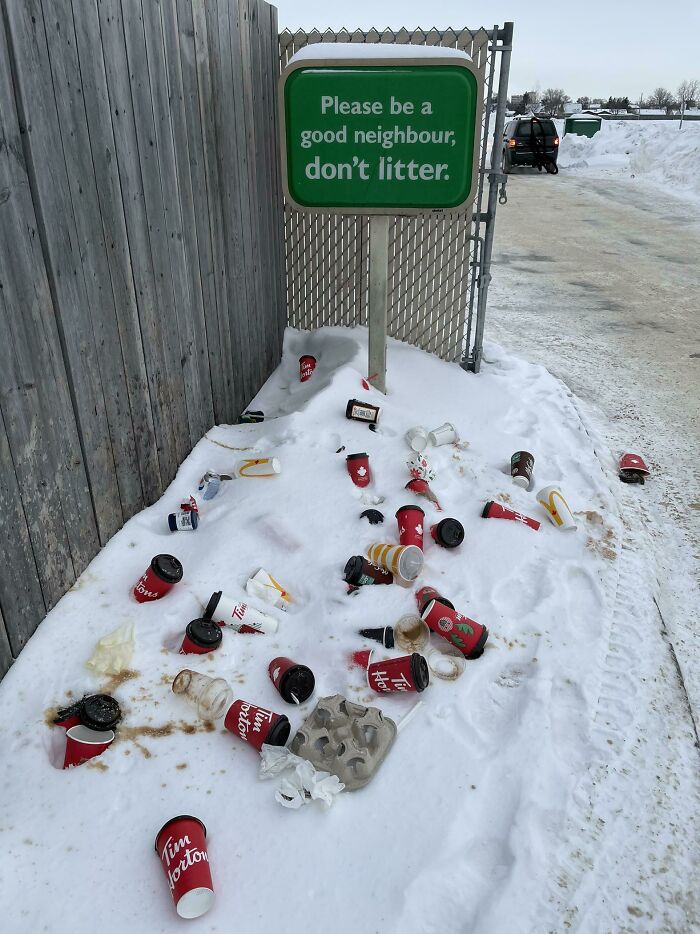 Green sign asks not to litter while trash litters snowy ground, illustrating depressing posts about traumatizing the next generation.