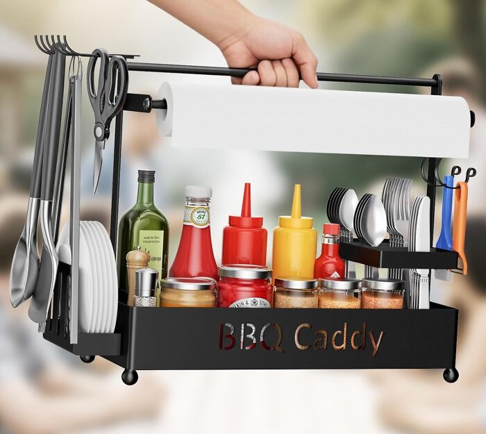 BBQ caddy organizer holding condiments, utensils, paper towels, and plates for backyard July 4th party essentials