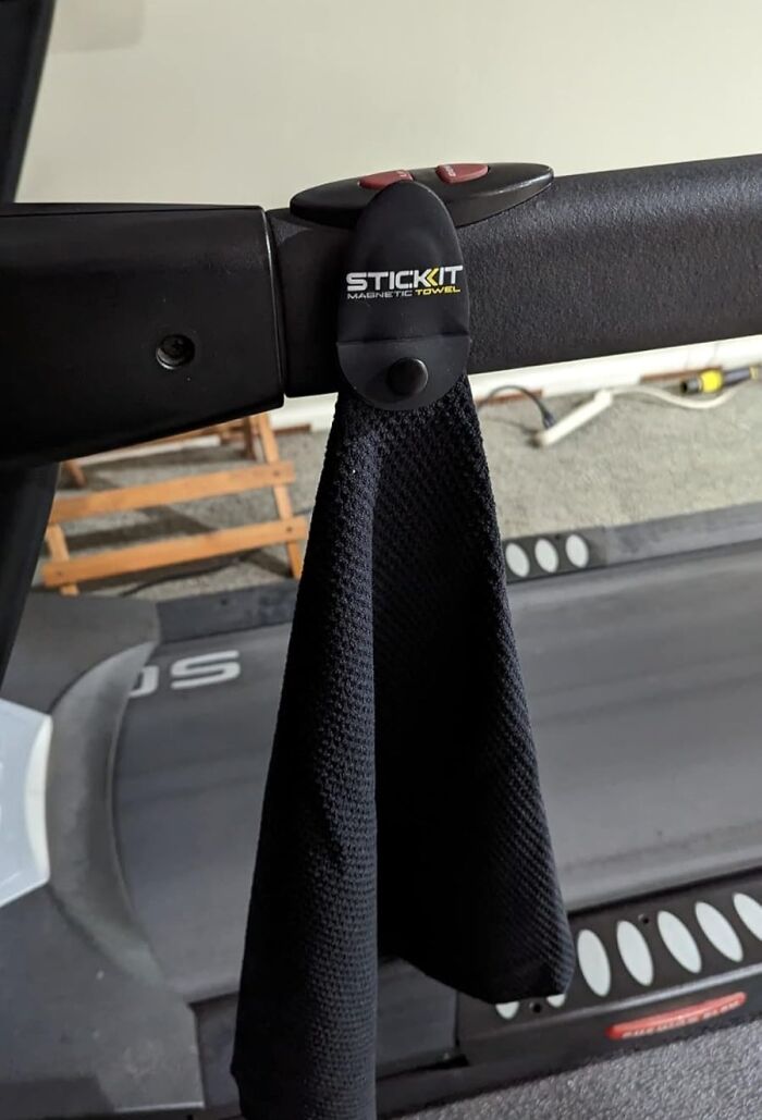 Magnetic towel holder attached to treadmill handle, showcasing one of the products for specific problems solution.