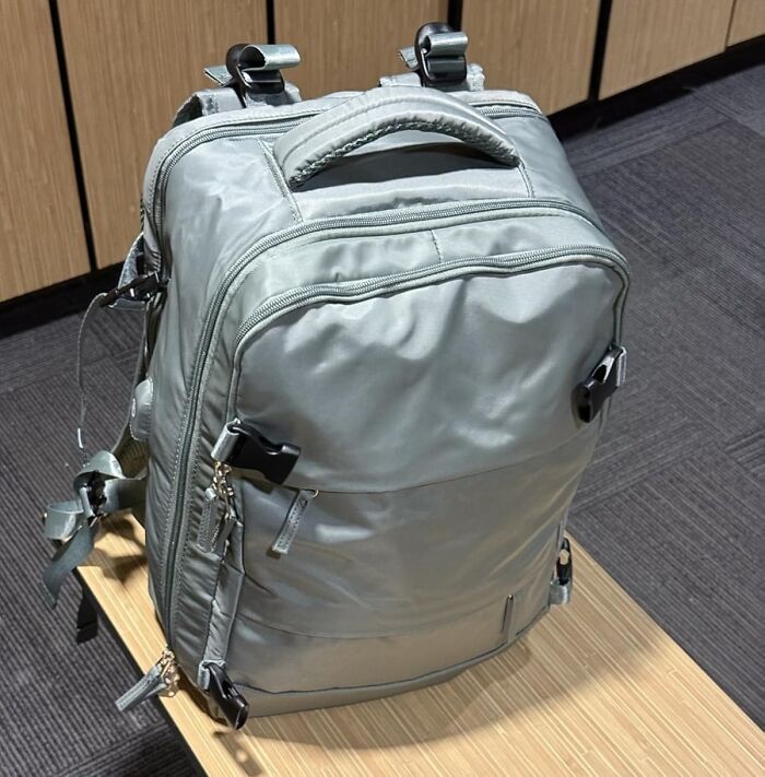 Silver multi-tasking backpack with multiple compartments and straps, designed as a versatile Swiss Army knife for your home use.