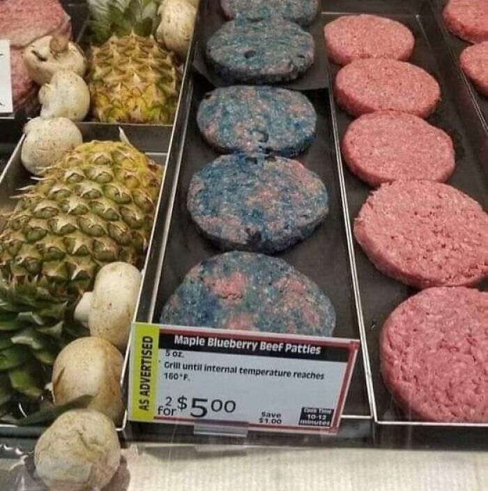 Blueberry beef patties displayed next to regular patties and pineapples, illustrating unusual and gross foods concept.
