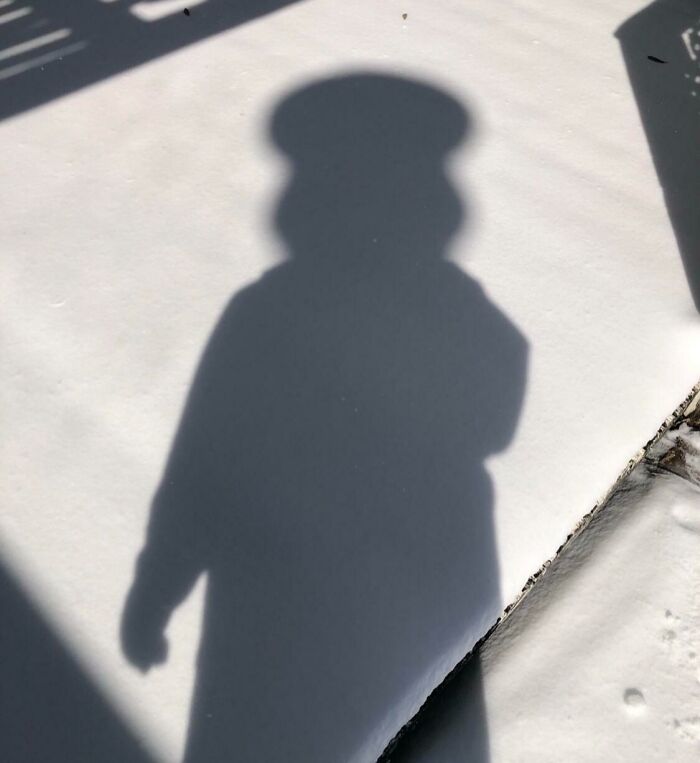 Shadow on snow creating a cool and interesting silhouette that made people look twice for its bizarre shape.