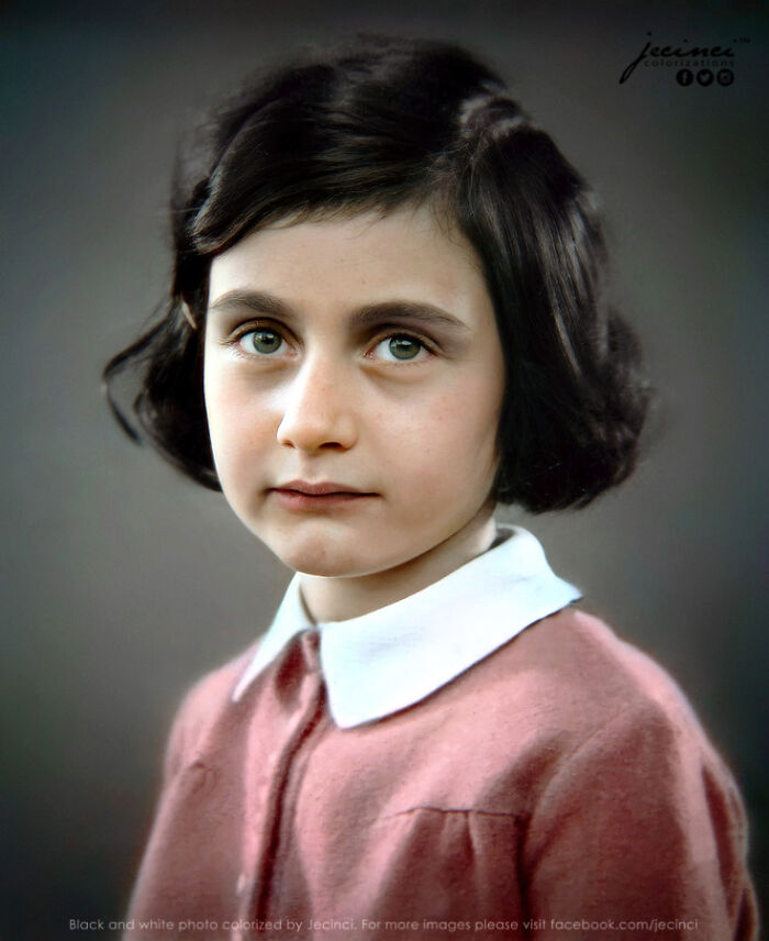 Young girl with dark hair and green eyes wearing a pink dress and white collar in an interesting colorized history pic.