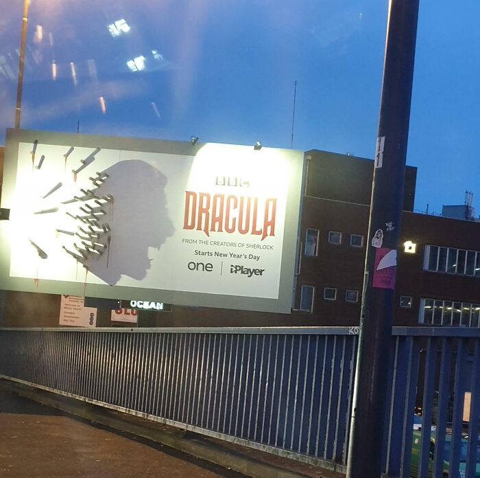 Shadow art on a billboard creates a cool and interesting silhouette resembling a vampire for intriguing shadows that made people look twice.