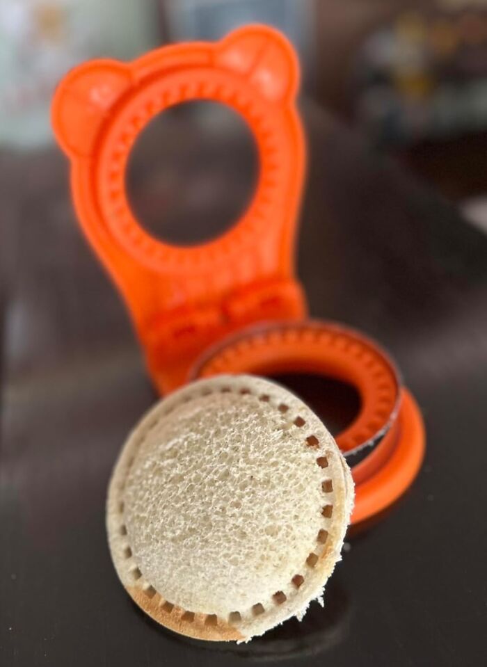 Orange kitchen gadget with a round sandwich cutter and shaped bread slice, showcasing Amazon most wished for weirdly wonderful items.