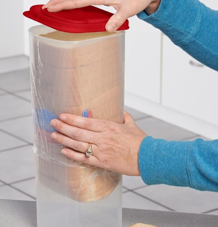 Person opening a modern food storage container, showcasing one of the old inventions with a major glow up in kitchen organization.