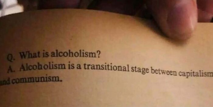 Close-up of a printed page showing a text-based meme about alcoholism, appealing to intellectuals and meme enthusiasts.