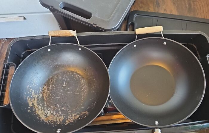 Comparison of two frying pans showing variety in wear and usage for cooking tools collection.