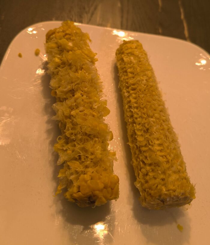 Two corn cobs with varied amounts of kernels eaten placed side by side, illustrating food comparison pics.