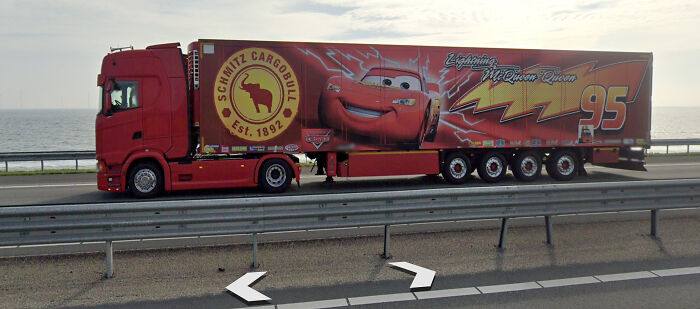 Red truck with a trailer featuring a Lightning McQueen design, one of the shenanigans captured on Google Maps.