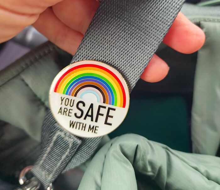 Pin with rainbow colors and message you are safe with me, highlighting pride pieces for year-round support and inclusion.