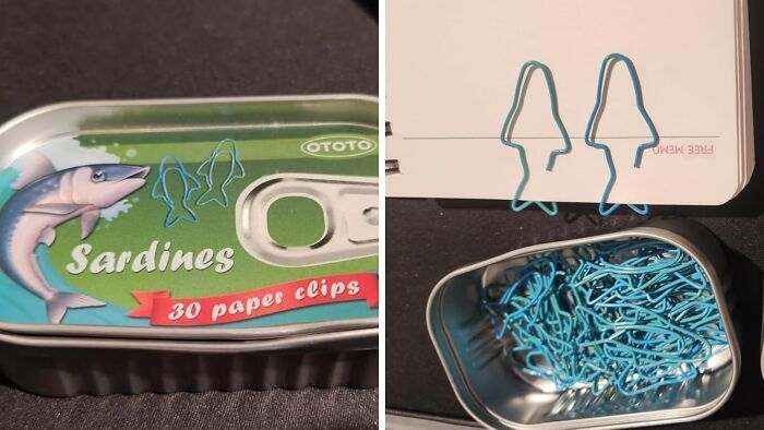 Tin of sardine-shaped paper clips with two clips holding notebook pages, showcasing desk accessories for 9-to-5 workspaces.