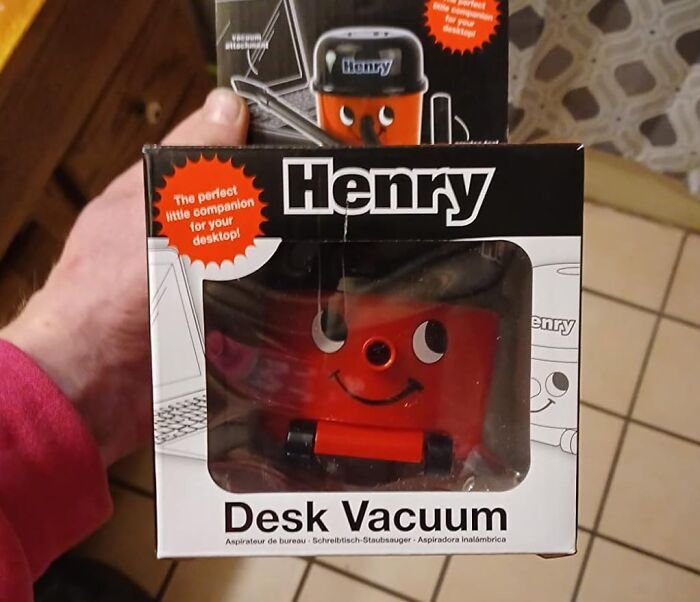 Henry desk vacuum in packaging, a compact desk accessory to make the 9-to-5 less blah and tidy workspace.