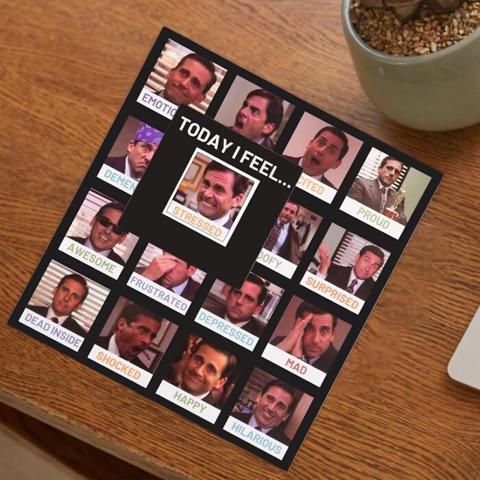 Mood chart featuring various facial expressions on a desk, one of the 23 things to make the 9-to-5 less blah.