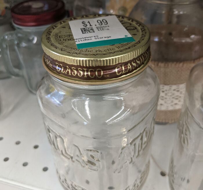 Glass jar with a Classico pasta sauce lid priced at $1.99 found at the thrift store among ridiculous finds.