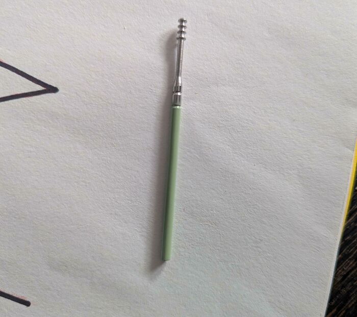 Small mystery object with a green handle and metal s***w-like top shared in online group to help recognize items