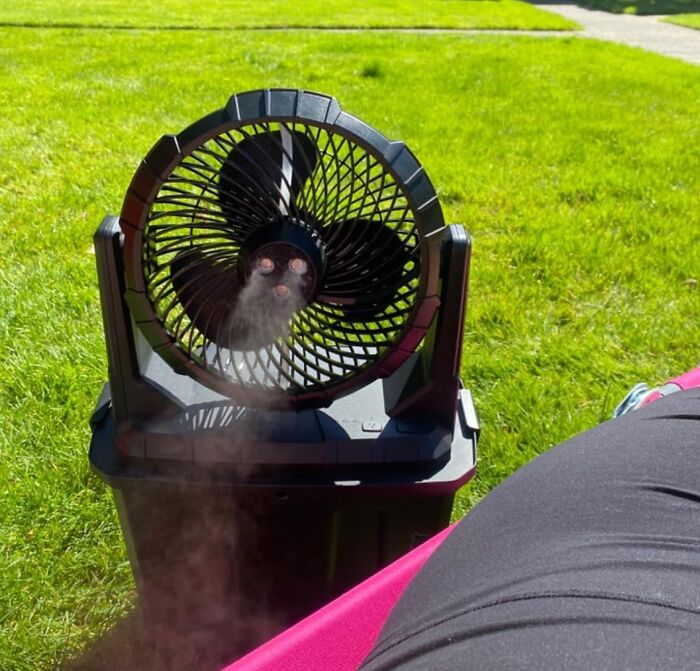 Portable misting fan cooling outdoors on a sunny day, one of Amazon's most wished for weirdly wonderful items.