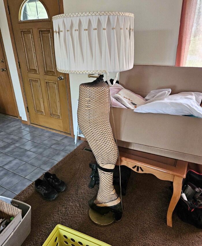 Leg lamp DIY project with fishnet stocking and shoe base, an example of horrendous craft shaming and failed DIY attempts.