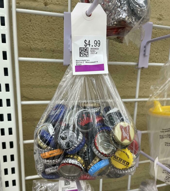 Bag of assorted bottle caps hanging with price tag in thrift store housewares section.