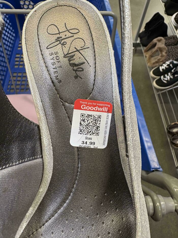 Ridiculous thrift store find: a single LifeStride shoe with a $34.99 Goodwill price tag in a shopping cart.