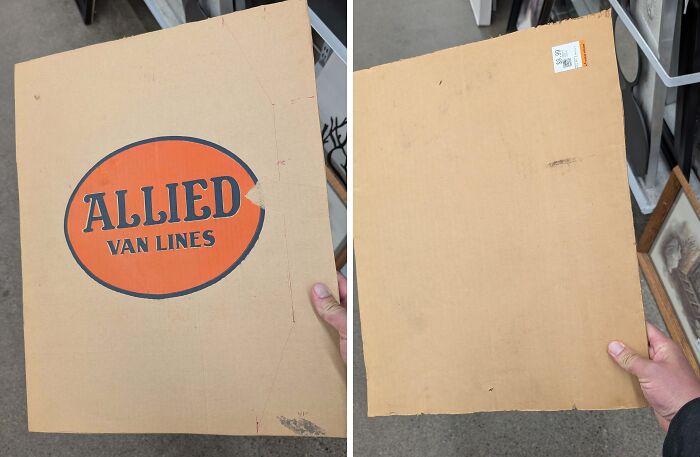 Cardboard piece with Allied Van Lines logo found at a thrift store, an unusual and funny thrift store discovery.