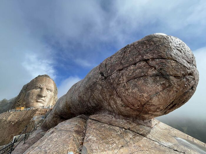 Close-up view of a famous landmark captured from an unexpected angle, highlighting unique stone textures and scale.