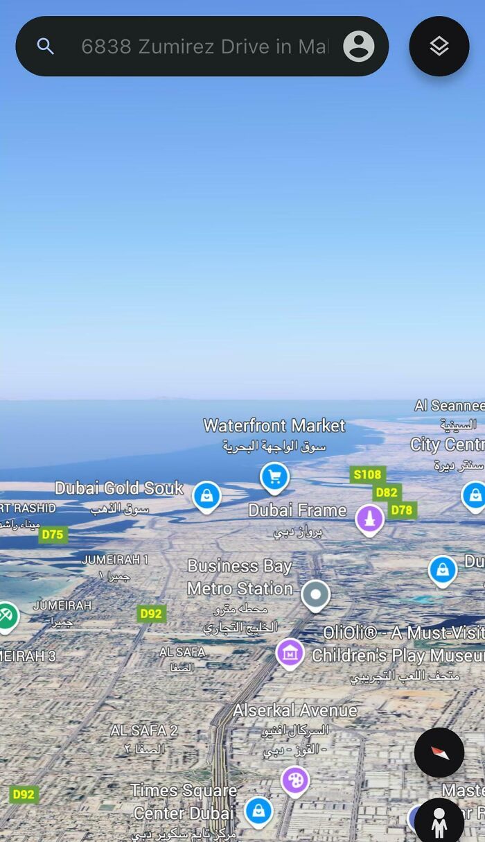 Satellite view of Dubai landmarks on Google Maps showing areas like Dubai Gold Souk and Business Bay metro station.