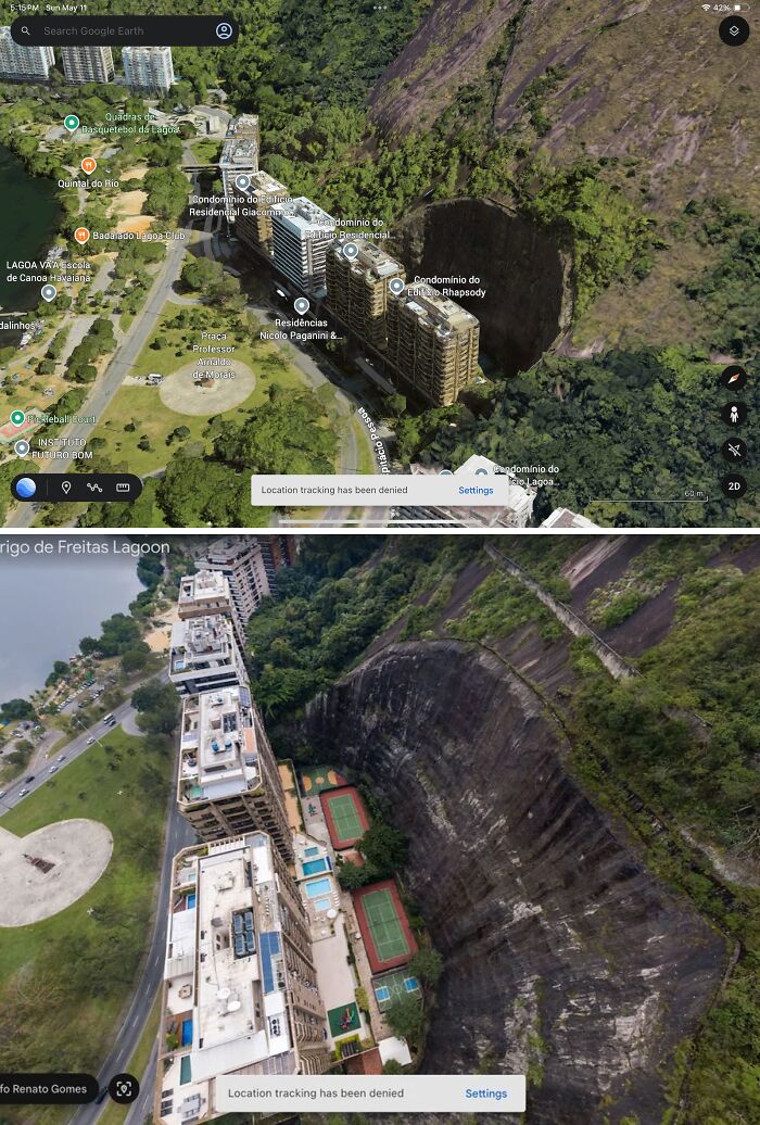 Aerial view of buildings next to a large rock cliff captured on Google Maps revealing unusual landscape shenanigans.