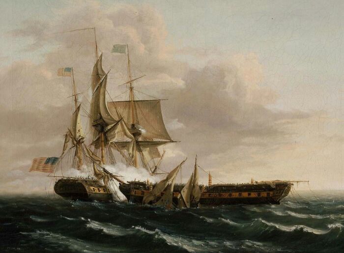 Historic naval ships engaged in battle on rough seas illustrating African American military history significance.