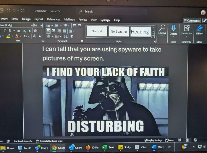 Computer screen in a toxic work environment showing a meme and a message about spyware capturing screenshots.