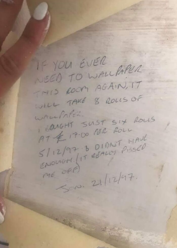 Handwritten note found under old wallpaper, a historical memento revealing past wallpaper quantity and pricing details.