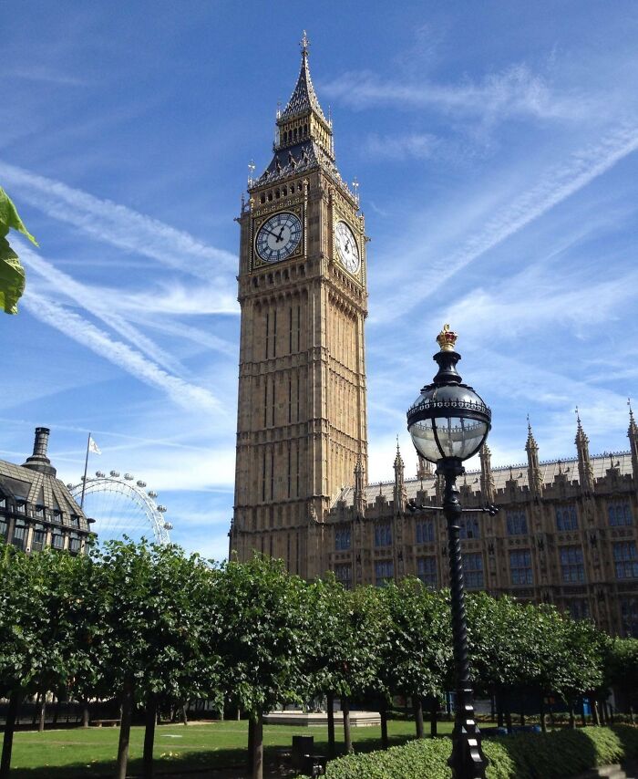 Big Ben clock tower and London Eye among famous landmarks captured from unexpected angles on a clear sunny day.