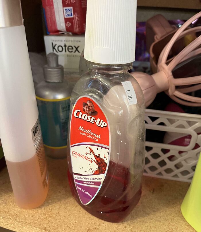 Ridiculous thrift store find: a half-used bottle of cinnamon-flavored Close-Up mouthwash with a $1 price tag.