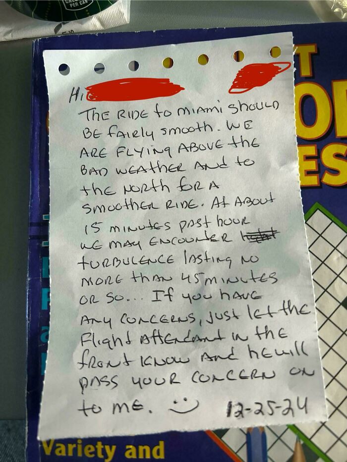 Handwritten note from flight crew reassuring passengers about turbulence on a flight, helping those with fear of flying feel calmer.