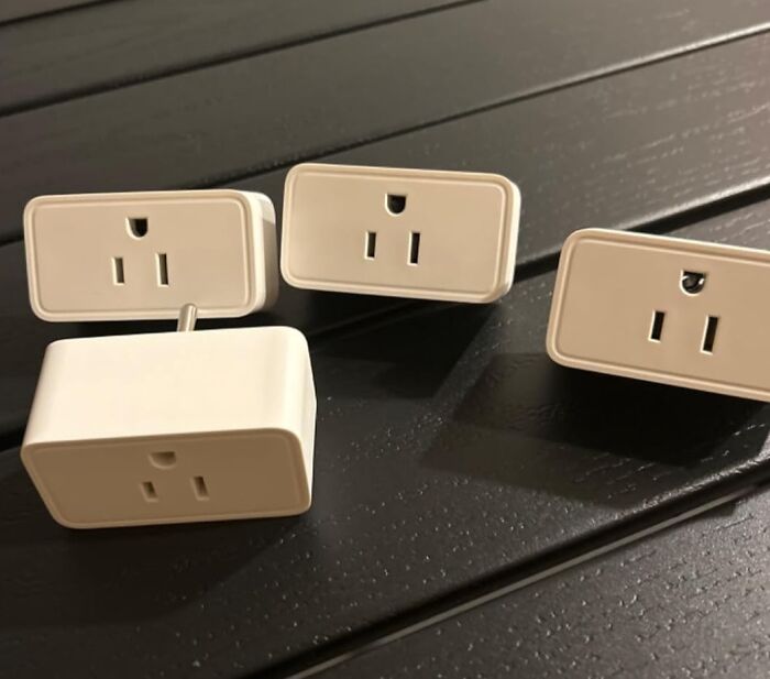 Smart plugs displayed on a dark surface, highlighting early deals available before Prime Day shopping event.
