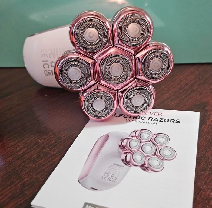 Electric razor with seven rotating heads displayed on a desk, highlighting early Prime Day deals and discounts.