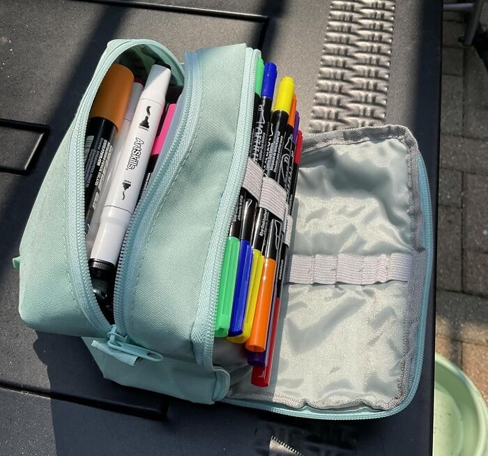 Light blue pencil case filled with colorful markers and pens, highlighting Prime Day deals on stationery and office supplies.