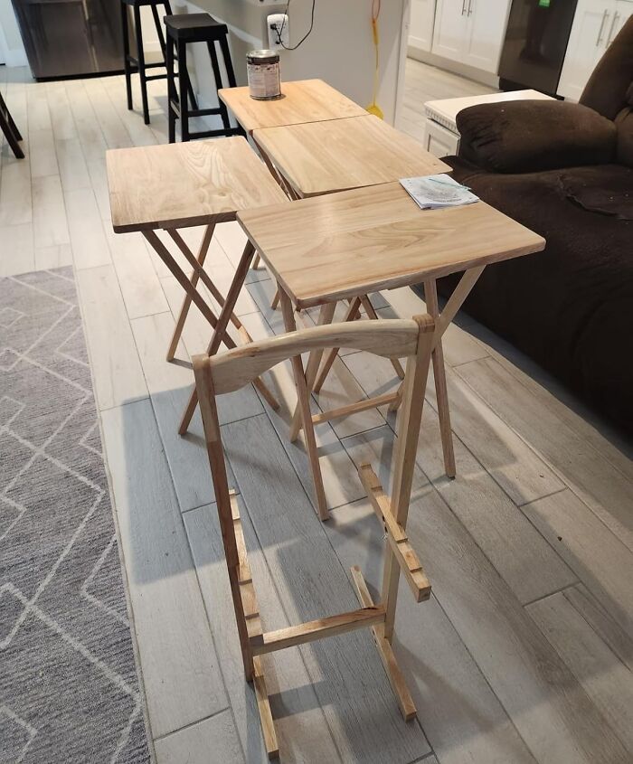 Wooden folding tables and chair set arranged in a living room showcasing early Prime Day deals on furniture.