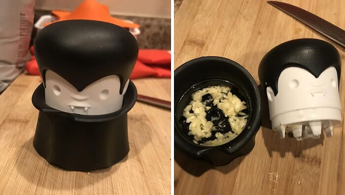 Vampire-themed quirky garlic press and crusher on a wooden cutting board, brightening kitchen tasks in unexpected ways.