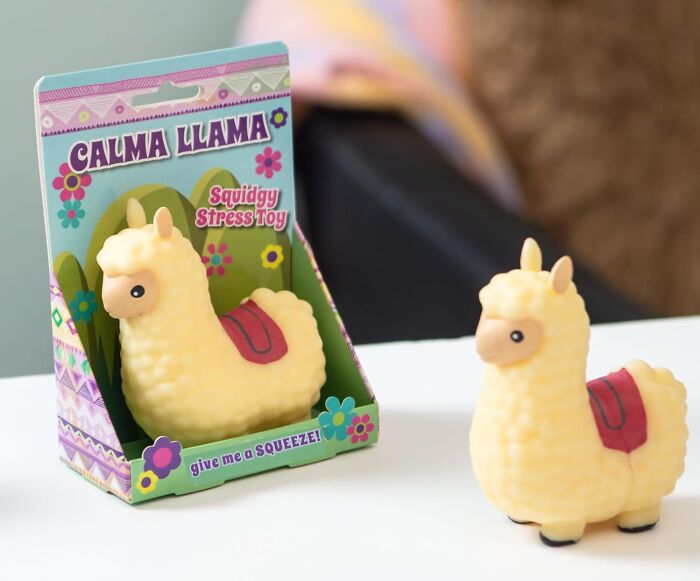 Yellow llama squishy stress toy displayed in colorful packaging, a quirky gem that brightens your day unexpectedly.