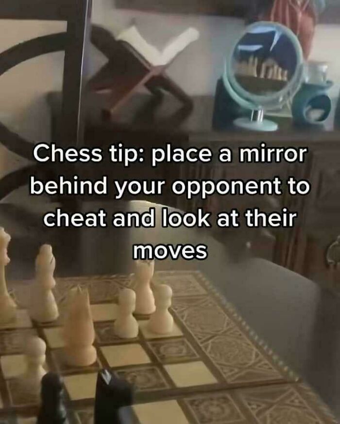 Chess pieces on board with a mirror behind, illustrating a funny internet lie about cheating using a mirror.