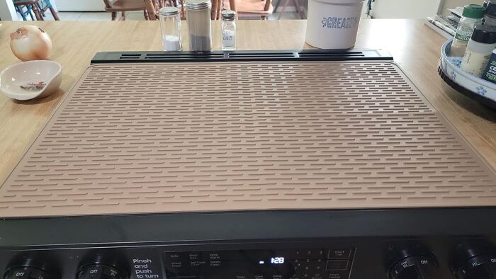 Non-stick kitchen griddle on stovetop, showcasing a popular cooking product trending in the Pandaverse virtual market.