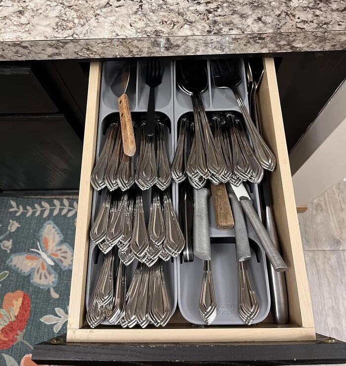 Organized kitchen drawer with silverware and utensils, showcasing trending products that flew off virtual shelves in the Pandaverse.