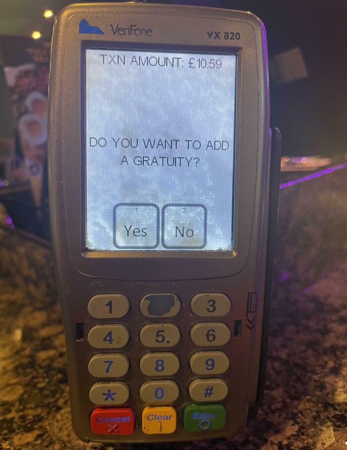 Payment terminal screen asking to add gratuity on a bill, highlighting ridiculous tipping culture issues.