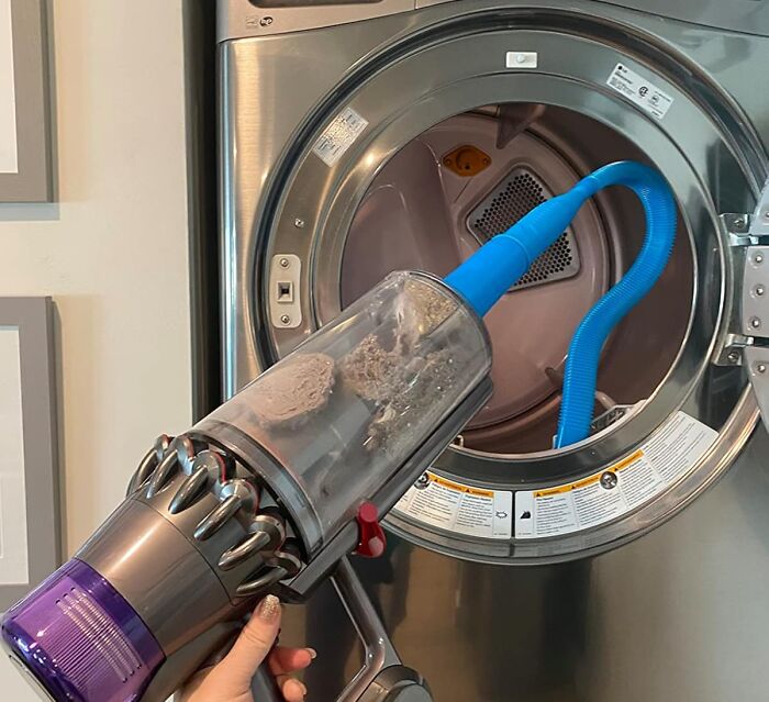 Handheld vacuum cleaning dryer lint trap using a flexible hose attachment featured in star performers products for the year’s halftime show.