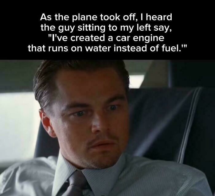 Man in a suit on a plane hearing a claim about a water-powered car engine, related to explain the joke memes.