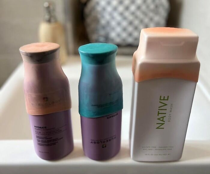Reusable silicone bottle covers in pastel colors placed on a bathroom sink, innovative finds for easier daily life.