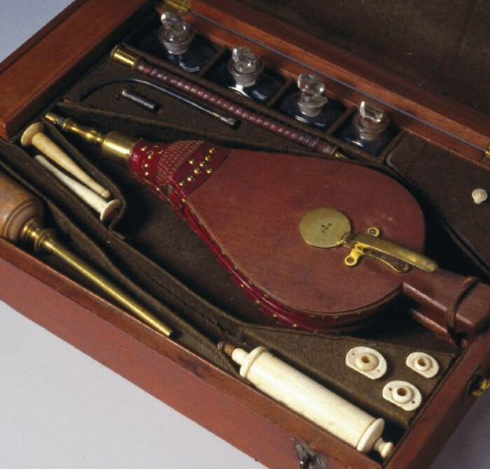 Antique medical kit with old-fashioned tools and accessories, a ridiculous pic from the past that would never fly today.