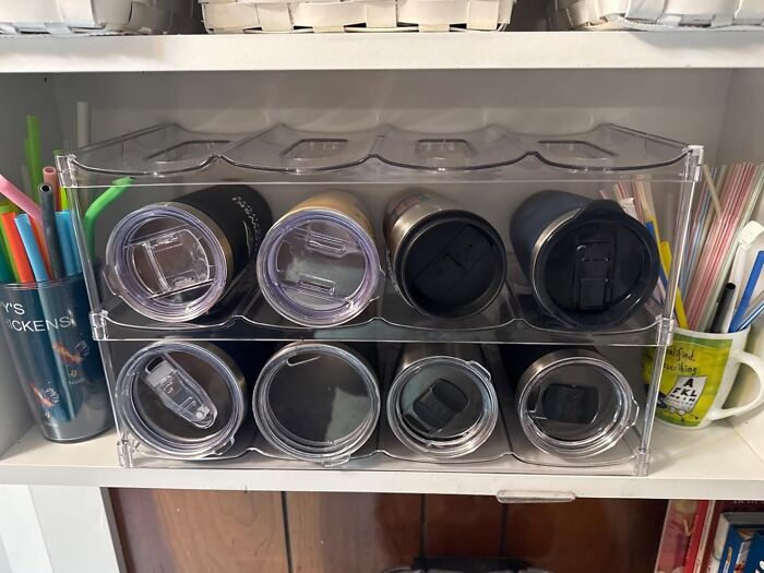 Clear plastic organizer holding assorted tumblers and cups neatly stored in a kitchen, kitchen Prime Day wishlist finds.