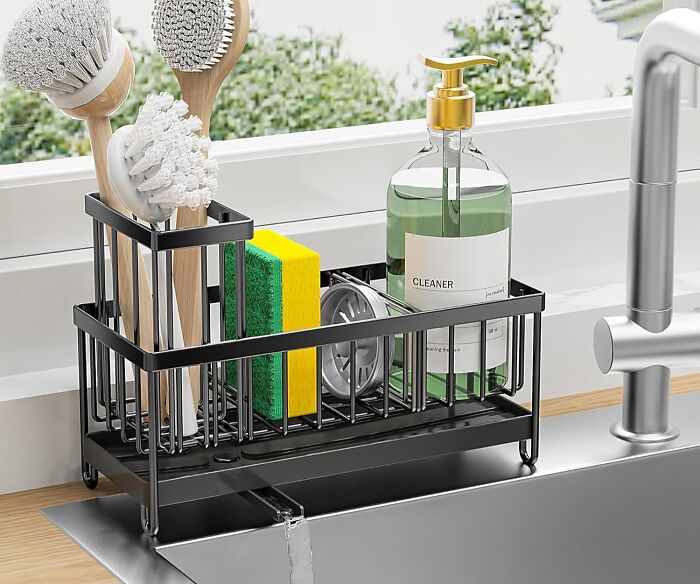 Kitchen organizer holding cleaning brushes, sponges, and soap near sink, perfect for your kitchen Prime Day wishlist finds.